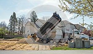 Large Commercial Dump Truck Unloading Stone