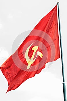 Large communist flag floating in the wind