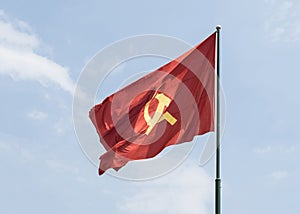 Large communist flag floating in the wind