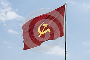 Large communist flag floating in the wind