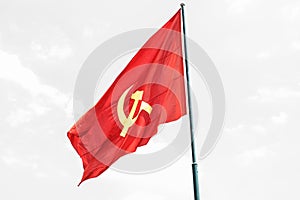 Large communist flag floating in the wind