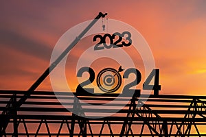 Large construction site, many construction cranes set vector numbers 2024. Construction team sets numbers for New Year 2024