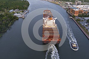 A large container ship leaves the port of Savannah after offloading its cargo