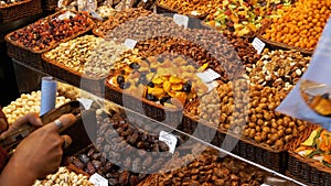 Large Counter of Dried Fruits and Nuts at a Farmers Market in La Boqueria. Barcelona. Spain