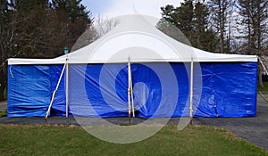 Large covered blue and white entertainment or events tent