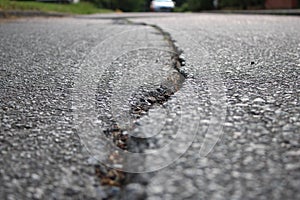 Large crack on a concrete residential road