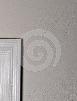 Large Crack Stems from Doorway