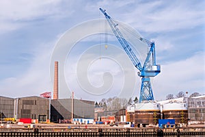 Large crane for loading different cargo. Industrial dock in Lubeck, Germany