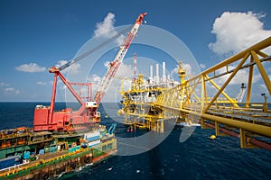 Large crane vessel installing the platform in offshore