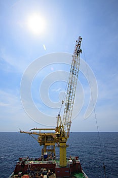 Large crane vessel installing the platform in offshore