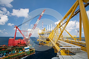 Large crane vessel installing the platform in offshore, crane barge doing marine heavy lift installation works