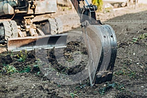 Large crawler excavator bucket. Excavator mechanical part for digging. Machines and mechanisms for construction