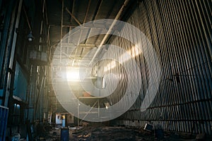 Large creepy industrial warehouse inside view of abandoned factory