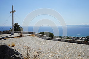 A large cross stands on a hill near the Church of Prophet Elias. Pefkos or Pefki, Rhodes island, Greece