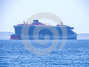 Large cruise liner in sea port of Mykonos Island in Greece