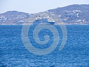 Large cruise liner in sea port of Mykonos Island in Greece