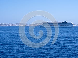 Large cruise liner in sea port of Mykonos Island in Greece