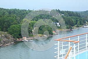 Large cruise ship deck near village