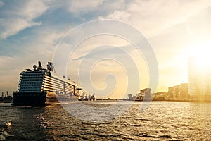 Large cruise ship on Elbe river during sunset