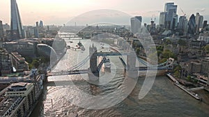 Large cruise ship going through London under the Tower Bridge.