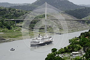 Large cruise ship passing under Panama's Centennial Bridge photo