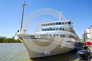 A large cruise ship with tourists on board stands at the pier on the central promenade of Rostov-on-Don. Russia