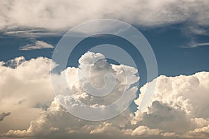 Large cumulous clouds fill the blue sky in Colorado