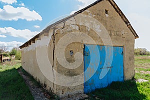 A large dangerous crack in the wall of the house. Destroying the house