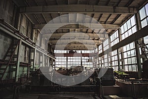 Large dark abandoned factory inside interior, abandoned industrial background