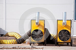 Large diesel heaters at a construction site. Equipment for heating a room in a cold period of time
