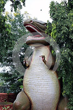 Large dinosaur sculpture at Nandankanan Zoological Park in Odisha, India