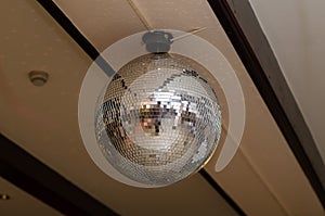 Large disco ball in a restaurant on the ceiling