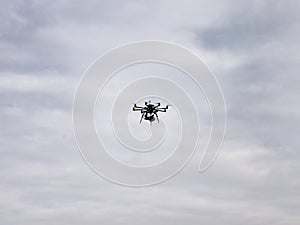 Large drone flying with a GH4 mirrorless camera attached photo