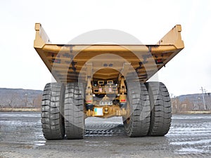 Large dump truck body rear view from the side of the body
