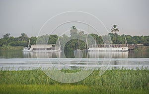 Large egyptian river cruise dahabeya boats moored on Nile