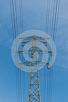 Large electric pylon with blue sky