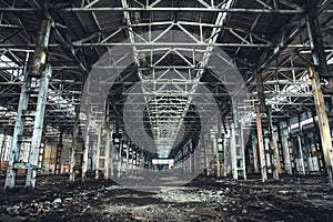 Large empty abandoned warehouse building or factory workshop