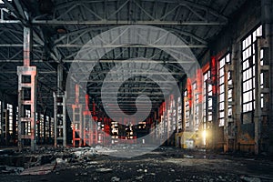 Large empty abandoned warehouse building or factory workshop, abstract ruins background