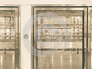 Large empty commercial fridges with temperature control at wholesale big-box store