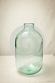 Large empty glass bottle with a volume of 10 liters