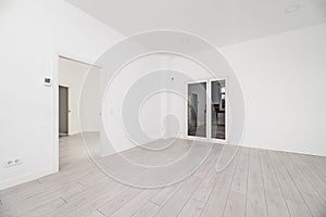 A large empty living room in a loft-style home