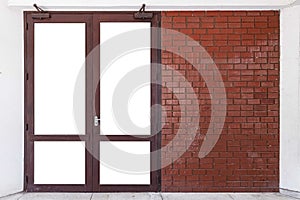 Large entrance door brown solid wood building and the red-brown brick wall