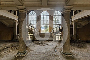 Large entrance hall with columns in old abandoned mansion, Sanatorium Imereti, Tskaltubo photo