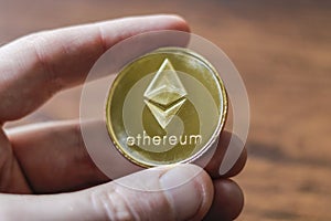 A Large Etherium Token in hand