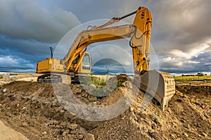 Large excavator on construction works of a highway