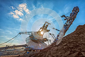 Large excavator machine in the mine