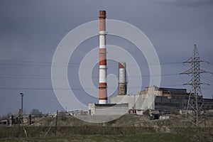 Large factory chimneys white red