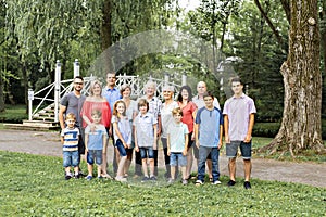 Large family with cousin grandparent father and kid on a forest