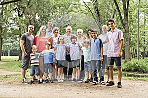 Large family with cousin grandparent father and kid on a forest