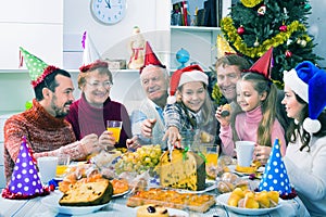 Large family eating together during festive Christmas dinner